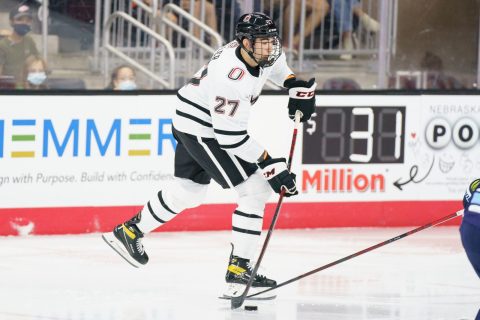 Schemmer seen at Baxter Arena - hockey dasher boards
